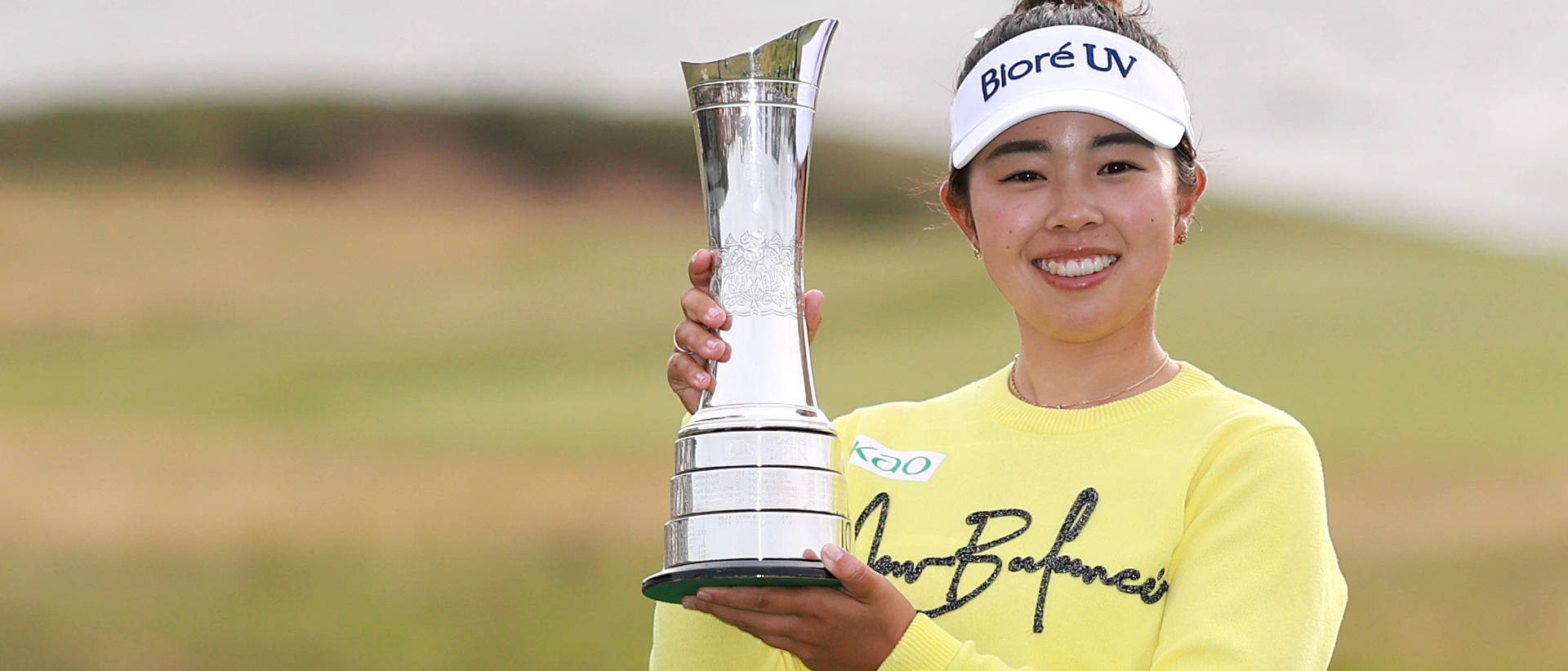 Miyu Yamashita poses with the trophy after winning the 2025 AIG Women's Open at Royal Porthcawl